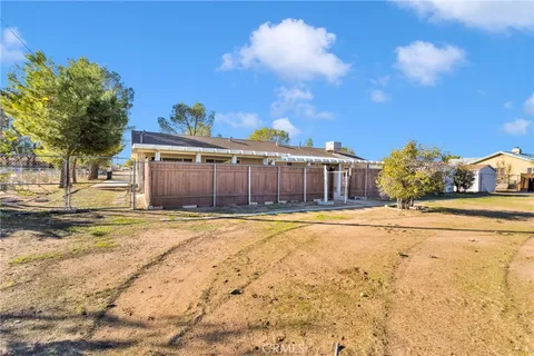 a view of a house with a snow on the road