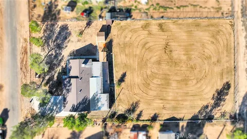 a buildings with green field in front of it