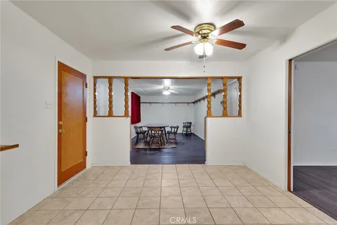 a view of livingroom with hardwood floor and a ceiling fan