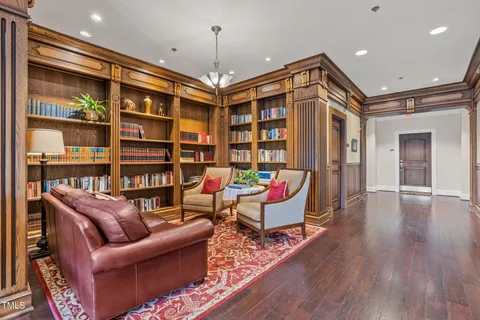 a view of living room with furniture and floor to ceiling windows