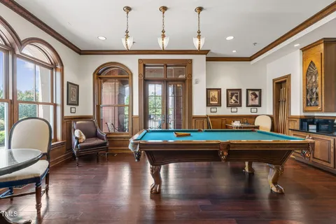 a living room with furniture fireplace and wooden floor