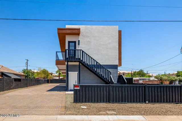 a view of a balcony with wooden floor