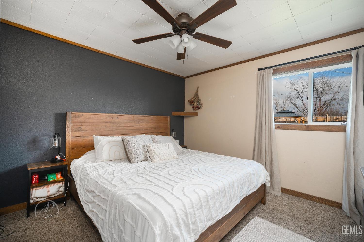 Undisclosed Address New Cuyama, CA 93254 - Photo 21 of 28 a bedroom with a bed and a painting on the wall