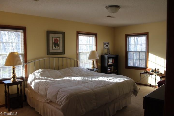 4804 Sweetbriar Road Greensboro, NC 27455 - Photo 13 of 14 Large master bedroom upstairs with vanity area and full bath