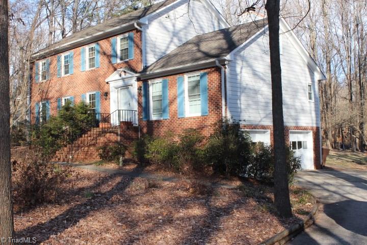 4804 Sweetbriar Road Greensboro, NC 27455 - Photo 3 of 14 Double car basement garage with concrete drive