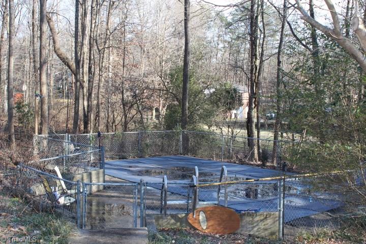 4804 Sweetbriar Road Greensboro, NC 27455 - Photo 4 of 14 Inground pool fenced in with nice cover
