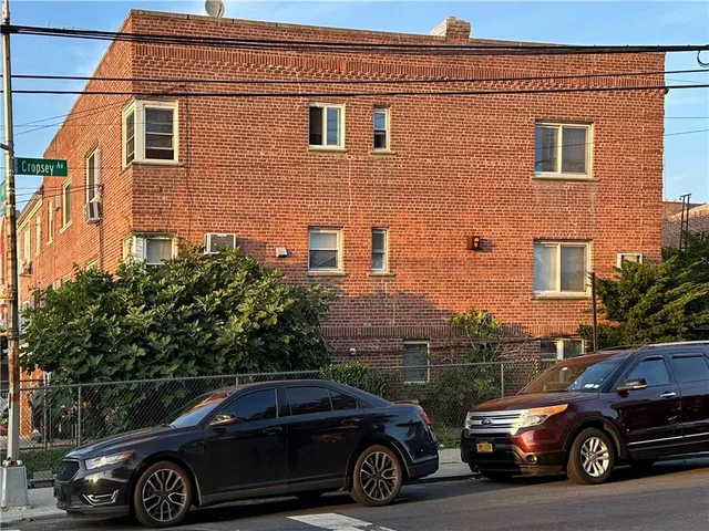 a view of a car parked in front of a house