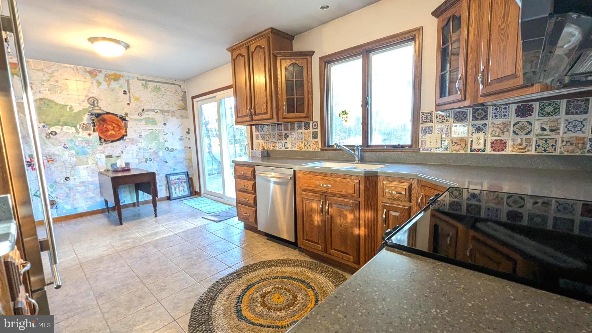 429 Simpson Street Bellefonte, PA 16823 - Photo 14 of 27 a kitchen with stainless steel appliances granite countertop a stove and a sink