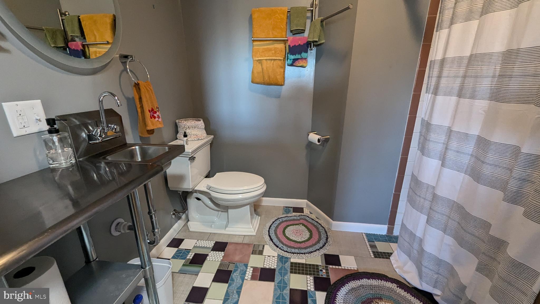 429 Simpson Street Bellefonte, PA 16823 - Photo 18 of 27 a bathroom with a toilet and a sink