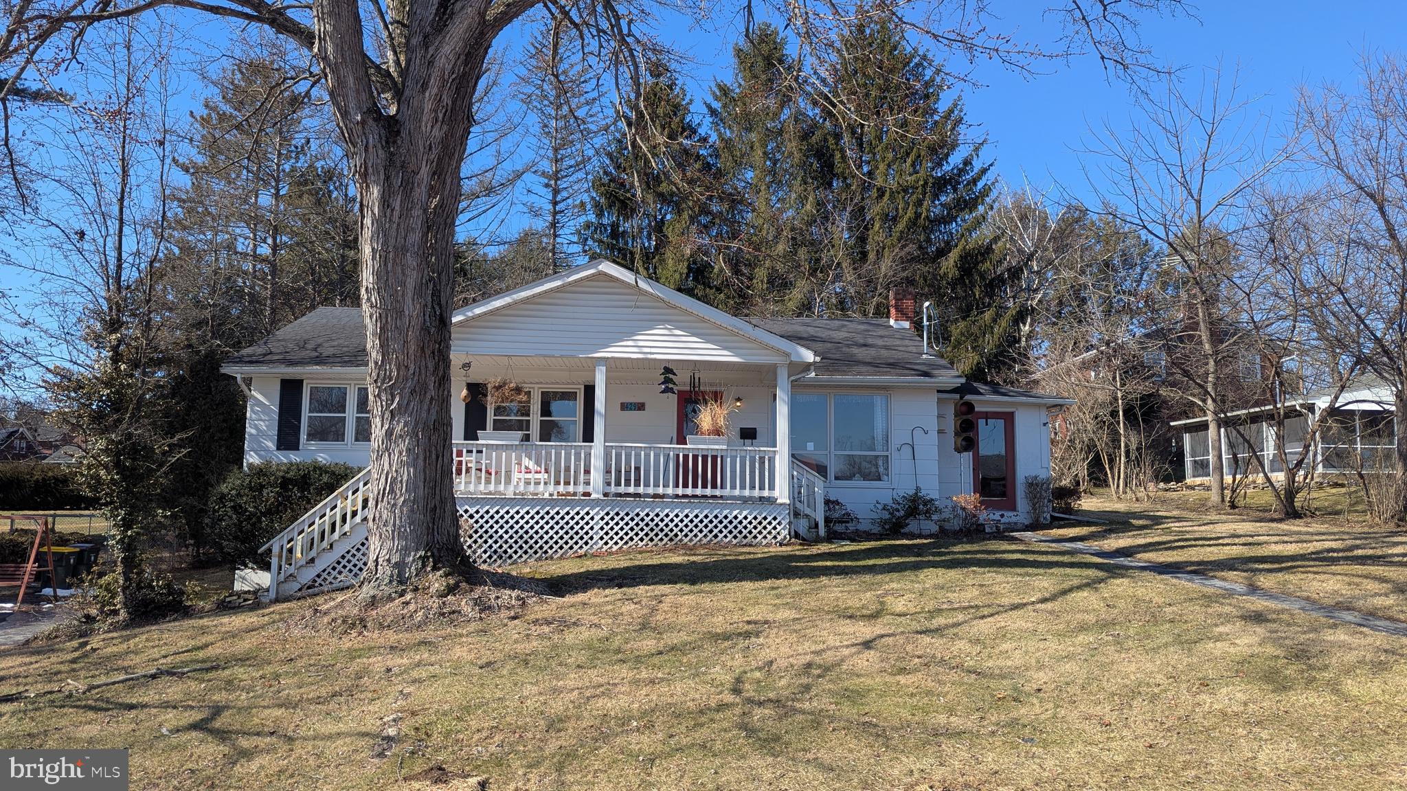 429 Simpson Street Bellefonte, PA 16823 - Photo 2 of 27 a front view of a house with a yard covered with snow