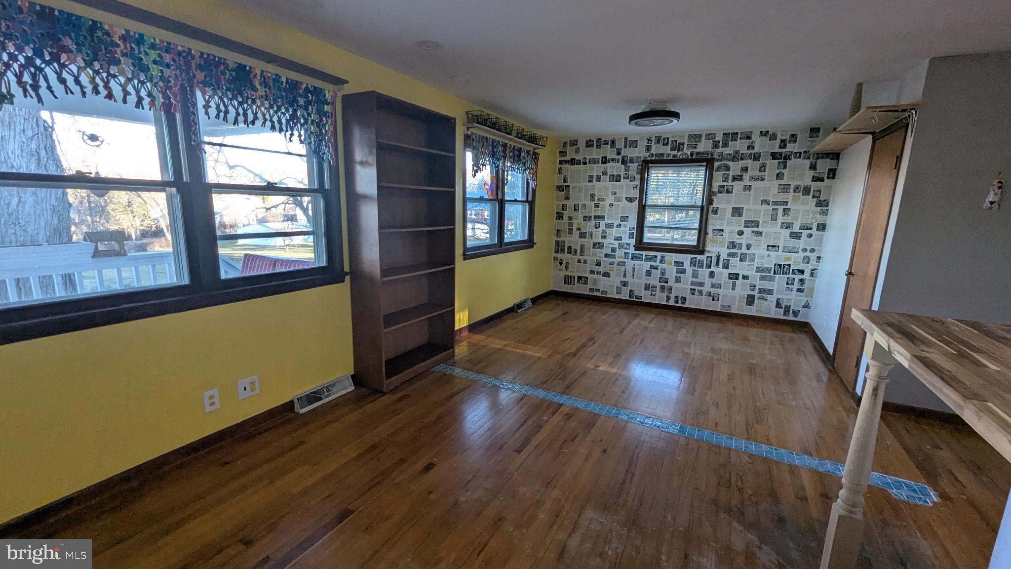 429 Simpson Street Bellefonte, PA 16823 - Photo 24 of 27 wooden floor in an empty room with a window