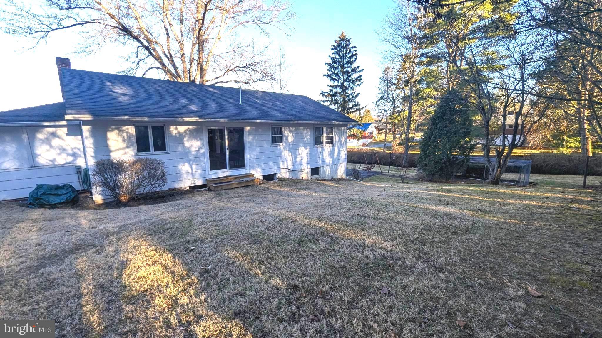 429 Simpson Street Bellefonte, PA 16823 - Photo 8 of 27 a front view of a house with a yard and garage