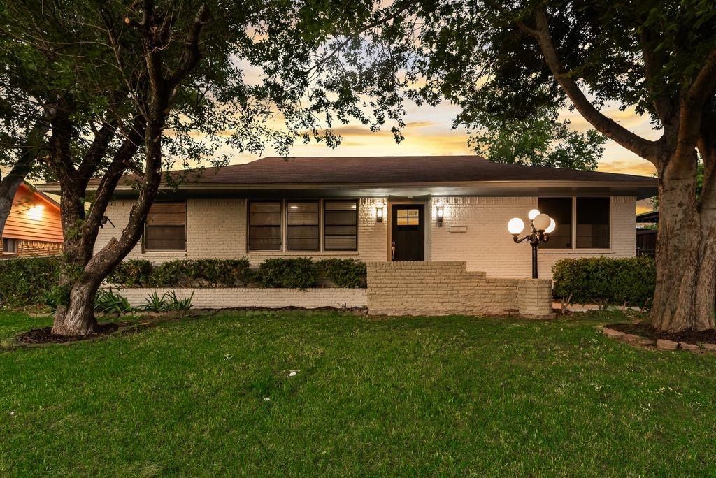 5706 Rocky Ridge Road Dallas, TX 75241 - Photo 1 of 31 a front view of a house with a yard
