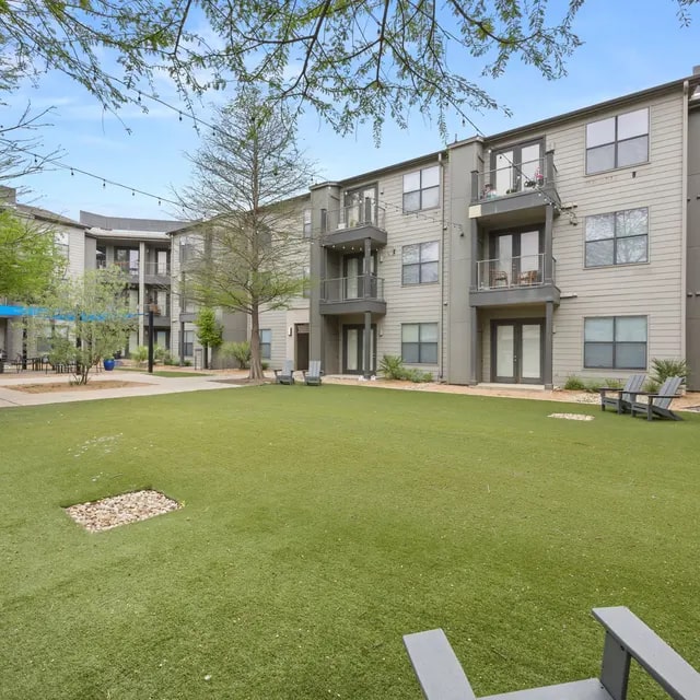 810 West St Johns Avenue, Unit 3114 Austin, TX 78752 - Photo 18 of 20 a house view with a garden space