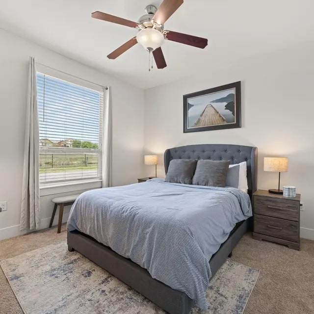 810 West St Johns Avenue, Unit 3114 Austin, TX 78752 - Photo 5 of 20 a bedroom with a bed and a window