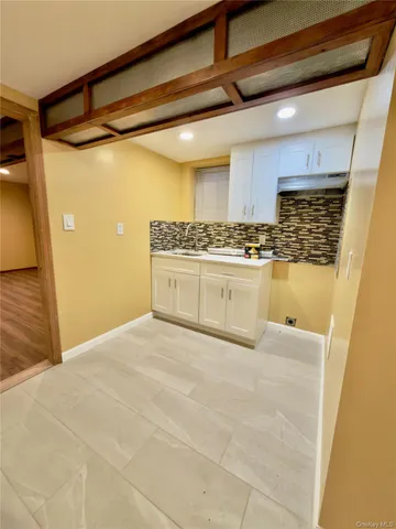 a view of a garage with wooden floor
