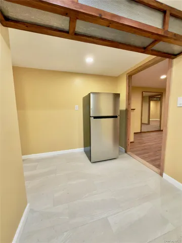 a view of a refrigerator in a kitchen
