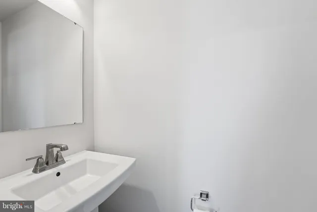 a bathroom with a sink a toilet and a bathtub