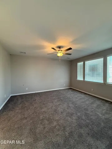 an empty room with a chandeliers