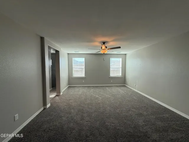 a view of living room with granite countertop furniture and a flat screen tv