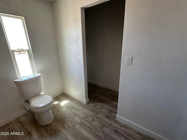 a bathroom with a toilet and a sink