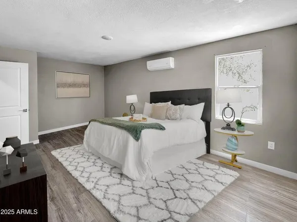 a bedroom with a bed and a table in it