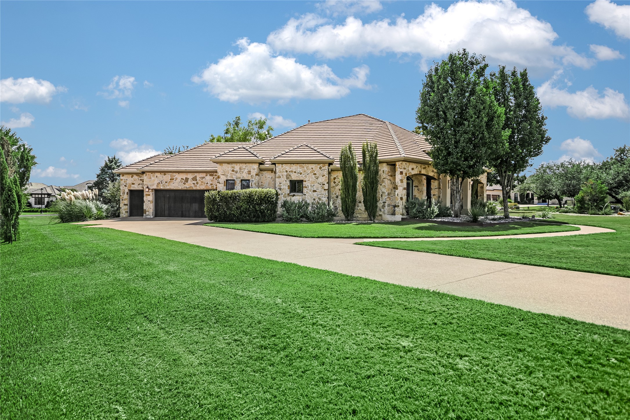 100 Dovetail Lane Georgetown, TX 78628 - Photo 3 of 34 Long driveway leads to a side back garage for 2 cars + golf cart. EV charger already installed and ready for you!