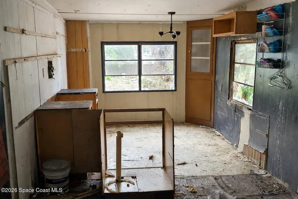 a view of hallway with a small living room
