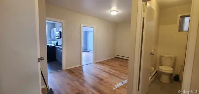 a view of a bathroom from a hallway