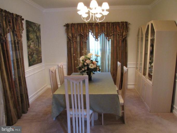 6 Vince Court Elkton, MD 21921 - Photo 3 of 21 a dining room with furniture a chandelier and window