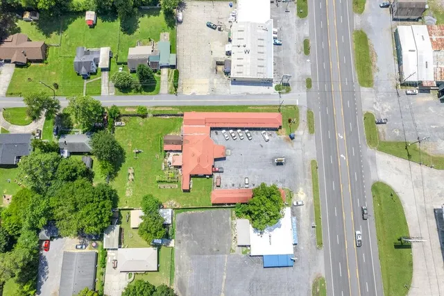an aerial view of a residential houses with outdoor space