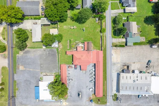 an aerial view of a house with outdoor space