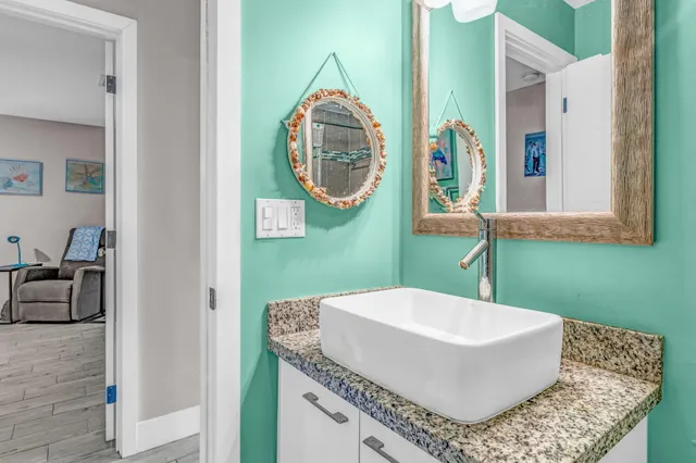 a bathroom with a mirror and a sink
