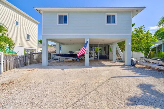a backyard of a house with outdoor seating