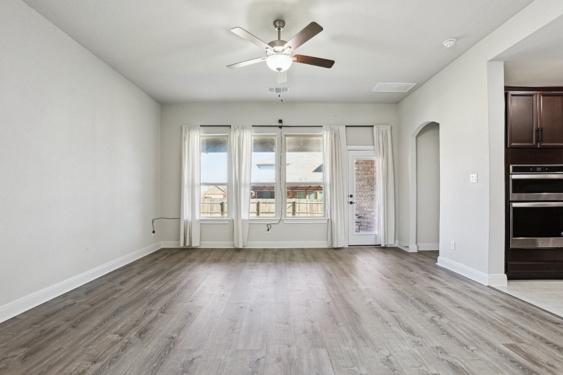 3602 Chaff Lane Pflugerville, TX 78660 - Photo 13 of 28 Spare room featuring light wood-type flooring and ceiling fan