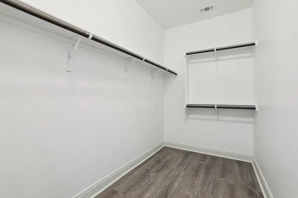 a view of an empty walk in closet
