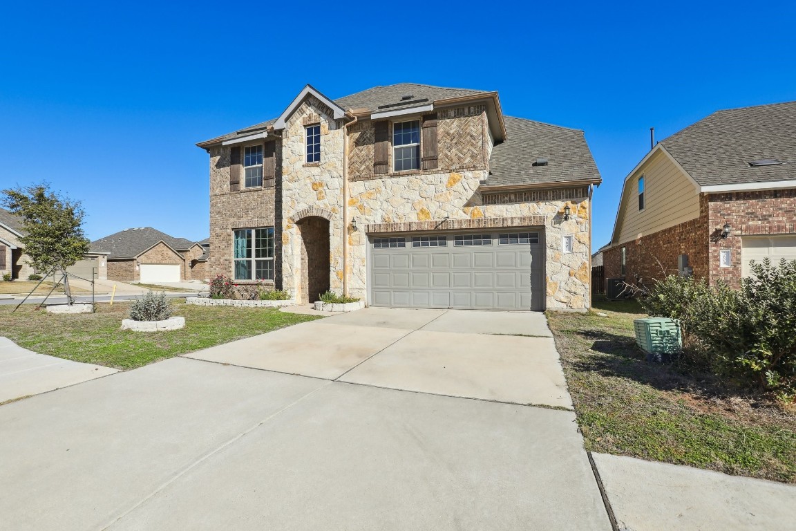 3602 Chaff Lane Pflugerville, TX 78660 - Photo 2 of 28 View of front of house featuring a garage