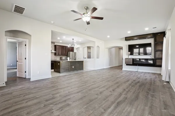 a view of kitchen with sink and wooden floor
