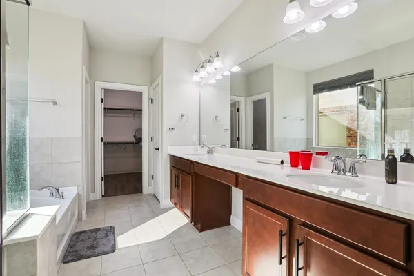 a bathroom with a sink a vanity and a mirror