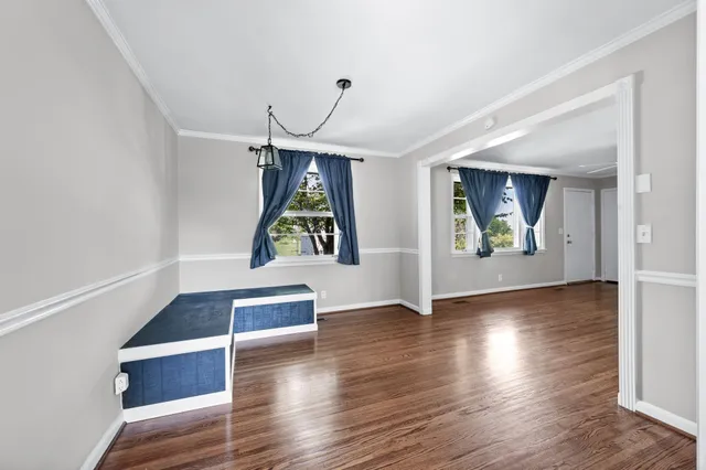 a view of an entryway with wooden floor