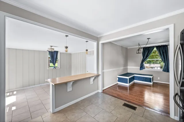 a view of kitchen with furniture and window
