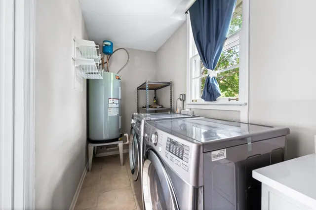 a kitchen with a sink a counter top space and a window