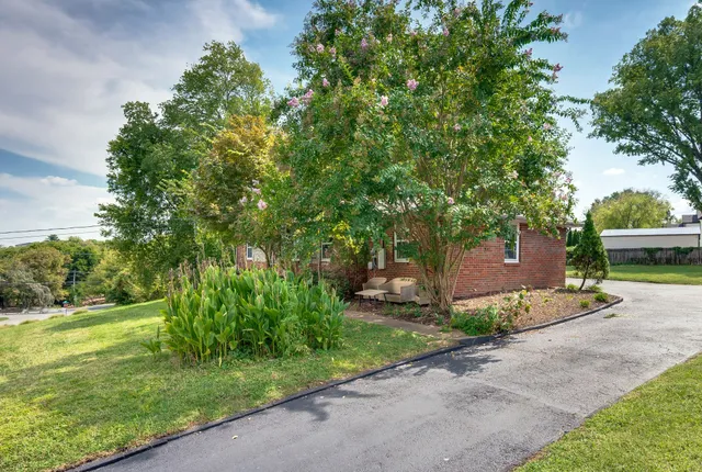 a front view of a house with garden