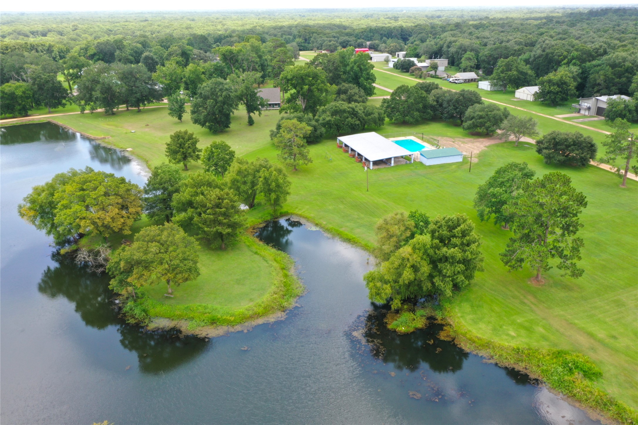 110 Red Bud Street Shepherd, TX 77371 - Photo 23 of 48 Lake Waterwheel and pool area