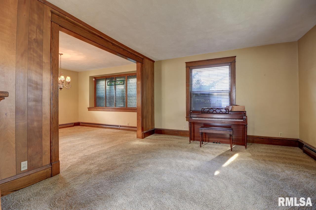 823 14th Avenue South Clinton, IA 52732 - Photo 12 of 27 a view of room with window and piano
