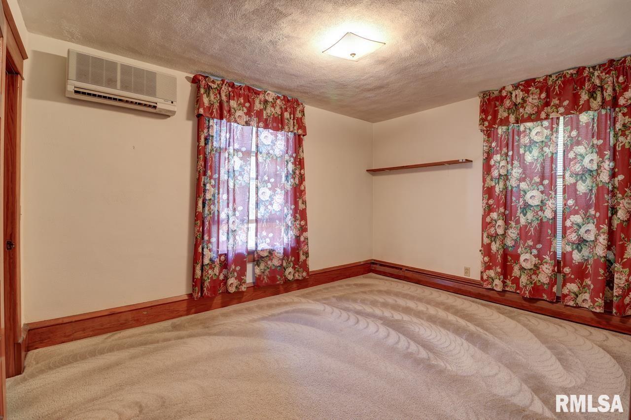 823 14th Avenue South Clinton, IA 52732 - Photo 15 of 27 a view of an empty room with window and gate