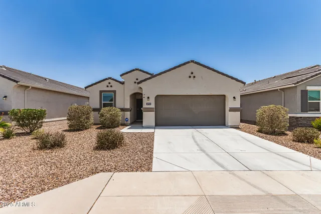 a front view of a house with yard