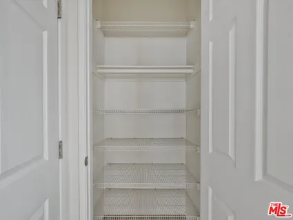 a view of an empty walk in closet
