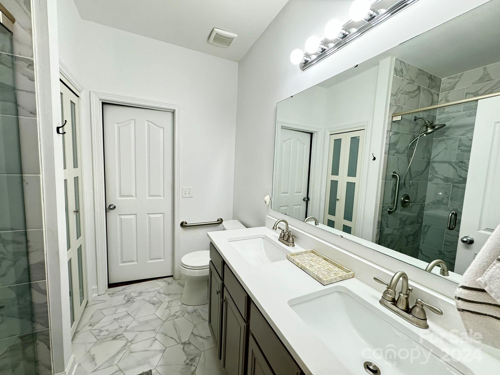 1031 Market Street Fort Mill, SC 29708 - Photo 11 of 26 a bathroom with a sink double vanity and a mirror