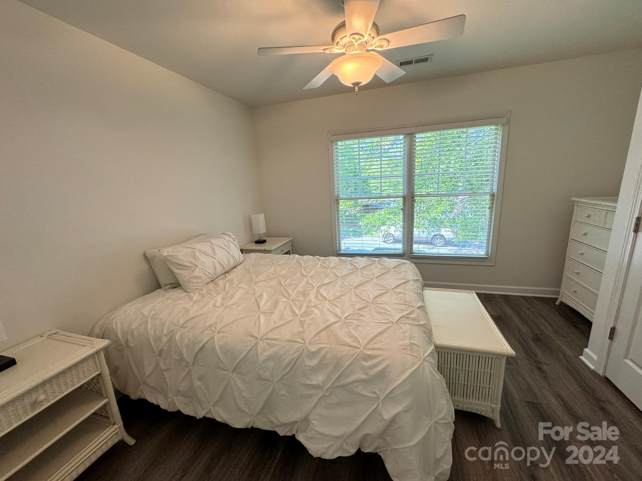 1031 Market Street Fort Mill, SC 29708 - Photo 18 of 26 a bed sitting in a bedroom next to a window